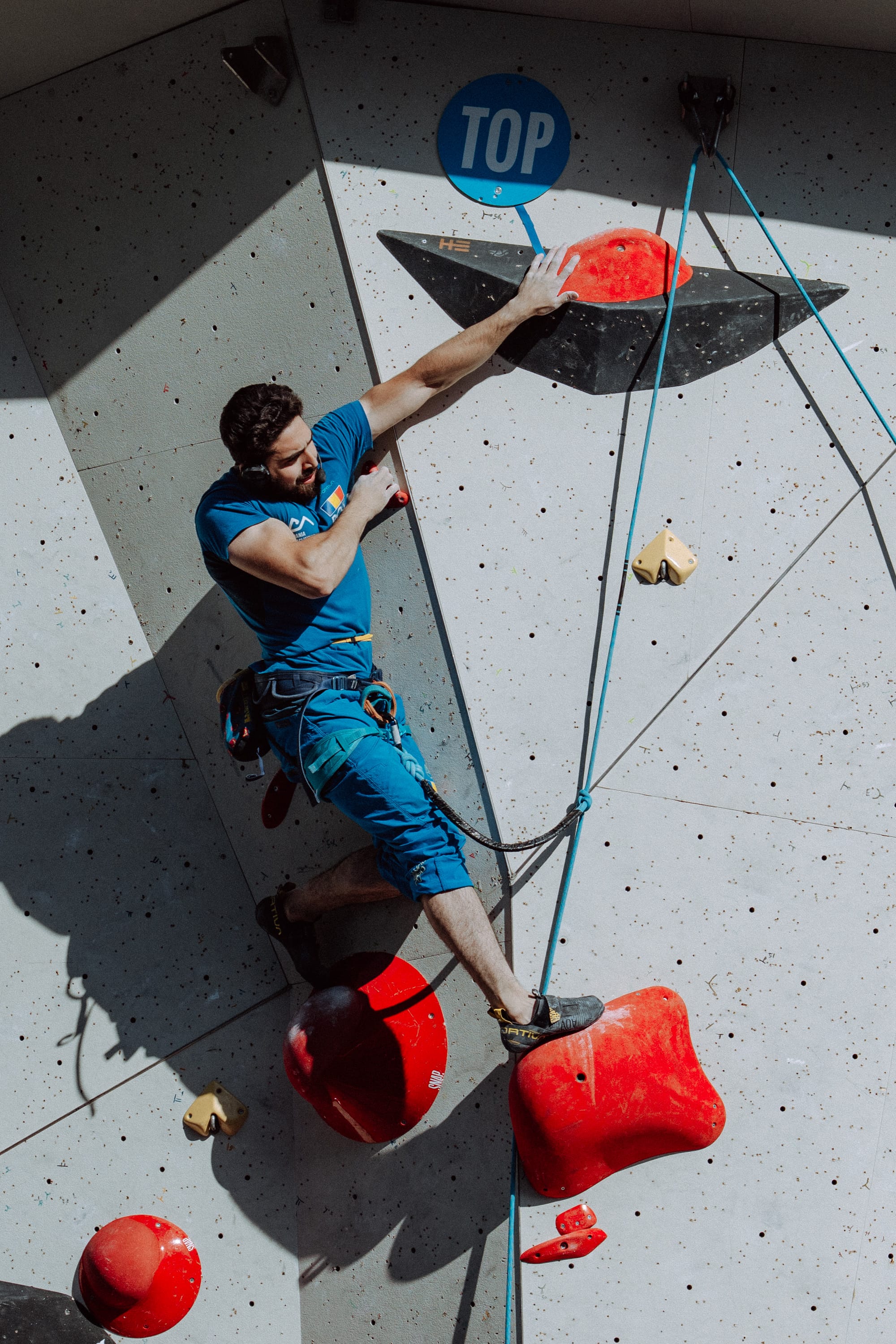 Cosmin Florin Candi reaching for the top hold
