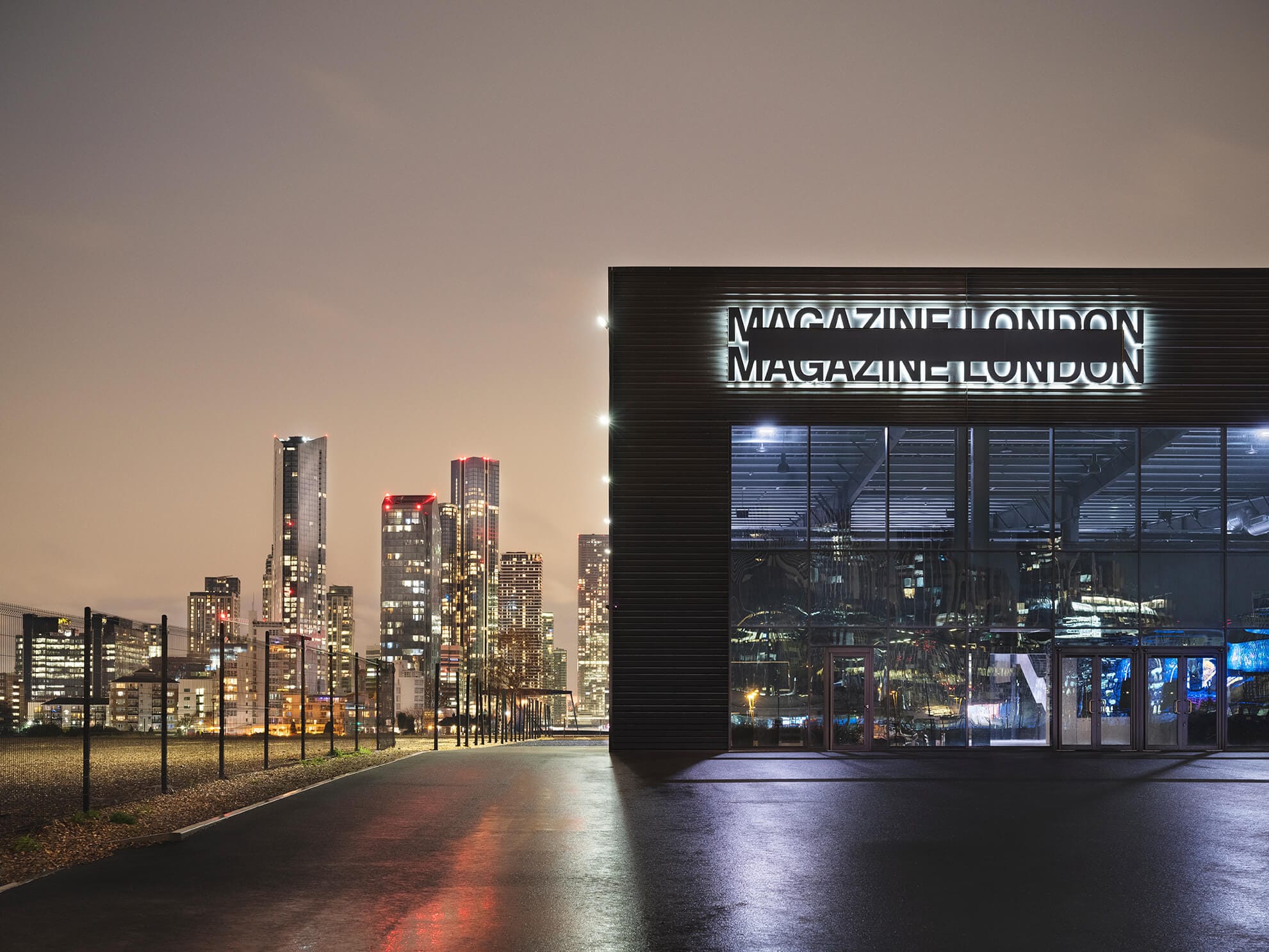 Magazine London at night with skyscrapers of London in the background