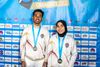 Rajiah Sallsabillah and Rahmad Adi Mulyono with their first gold medals from the IFSC Speed World Cup in Chamonix, 2023