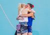 Janja Garnbret hugging Brooke Raboutou after they win their Olympic medals