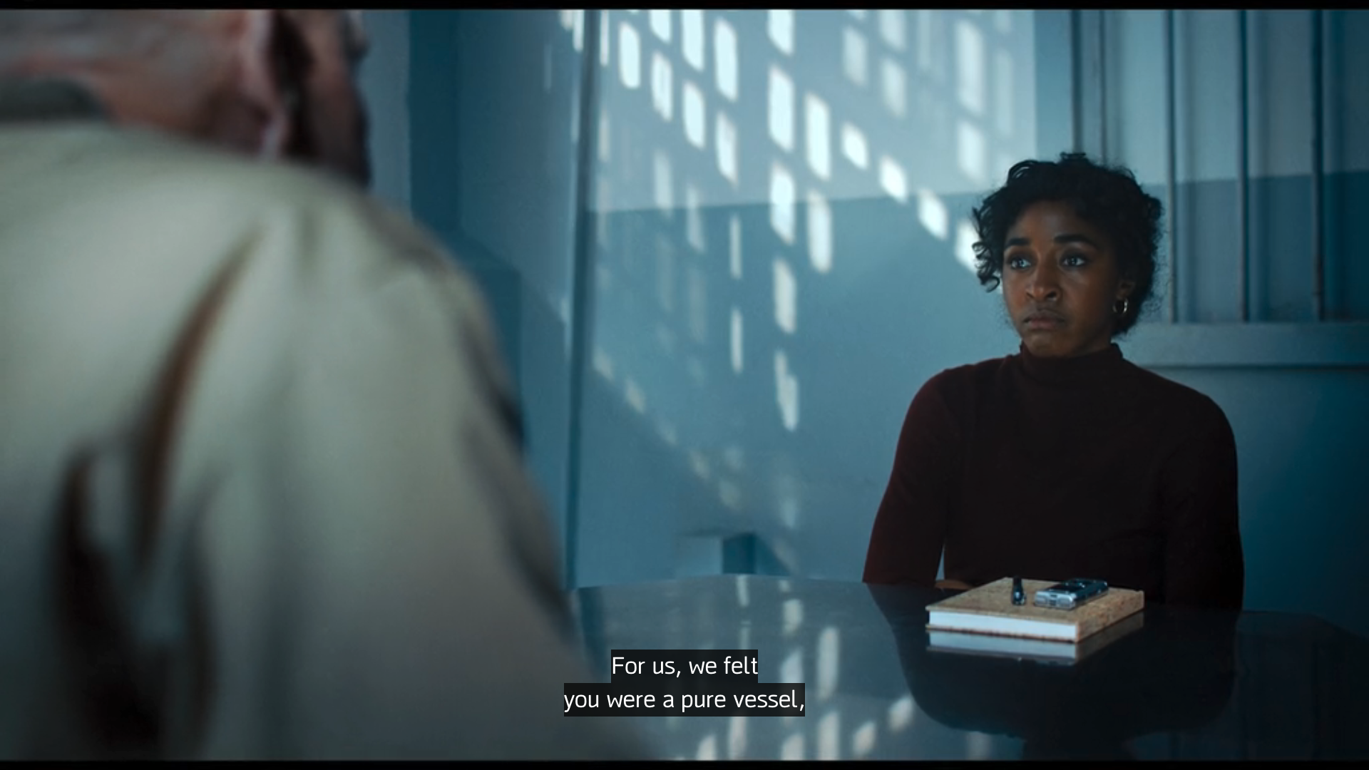 Ariel faces Moretti in prison at the end of A24's movie, Opus