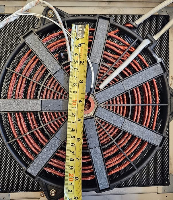 Measuring tape across coils of induction burner