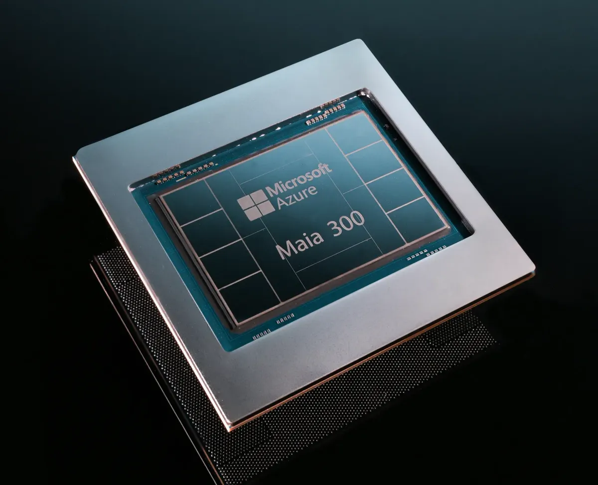 Close-up of a Microsoft Azure Maia 300 prototype chip, tilted diagonally against a dark background.
