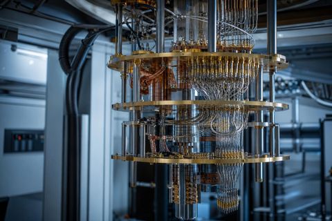 Editorial image of a precise quantum computing laboratory structure with layered control hardware, symbolizing fault-tolerant quantum computing as an infrastructure challenge.