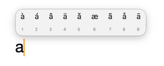 Long-press popup showing accent mark options for the letter A in Pages, Numbers, and Keynote, including à, á, â, ä, ă, æ, ã, å, and ā.
