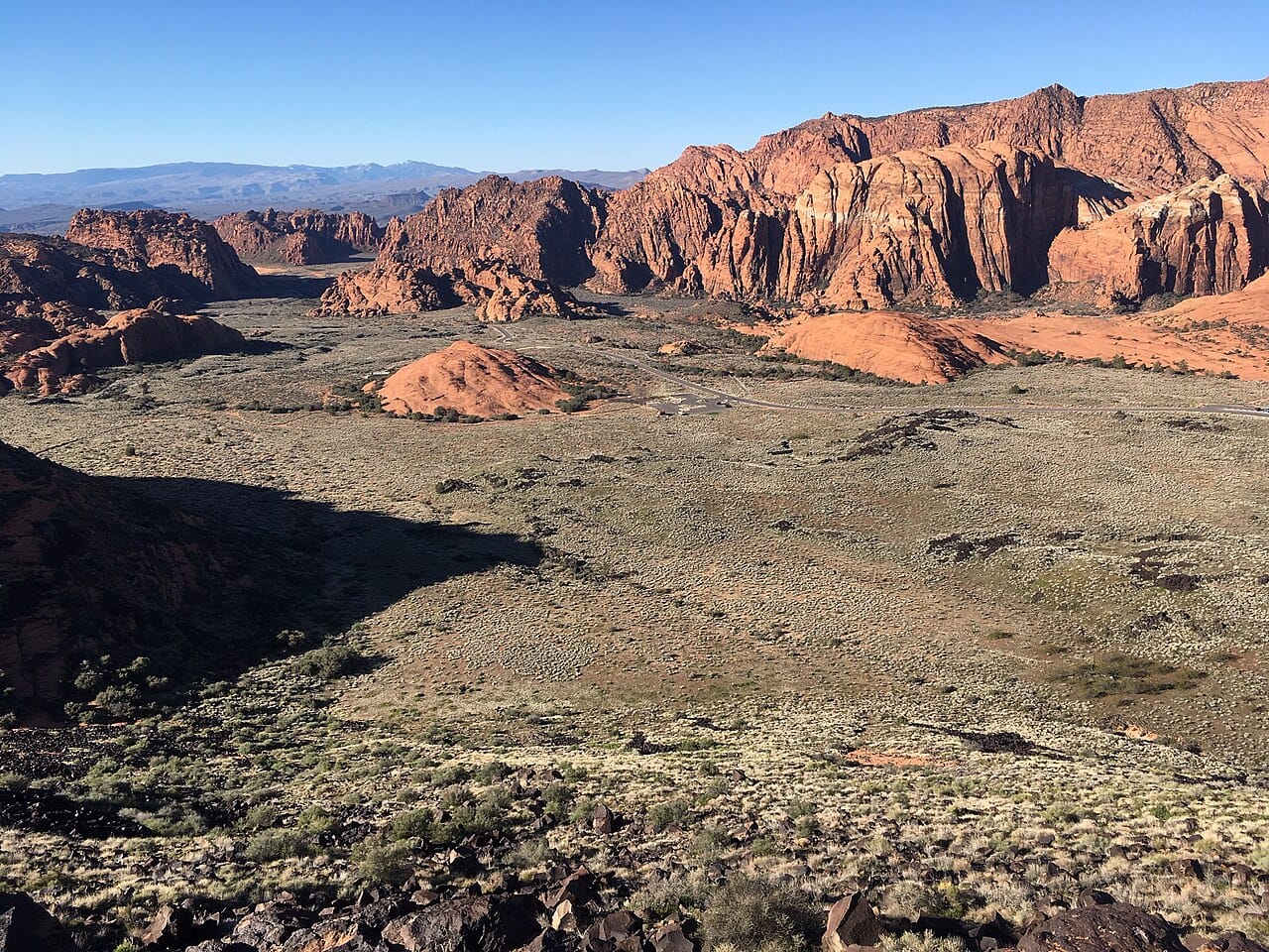 Red sandstone cliffs and Mojave desert scrub at Snow Canyon State Park near St. George, Utah