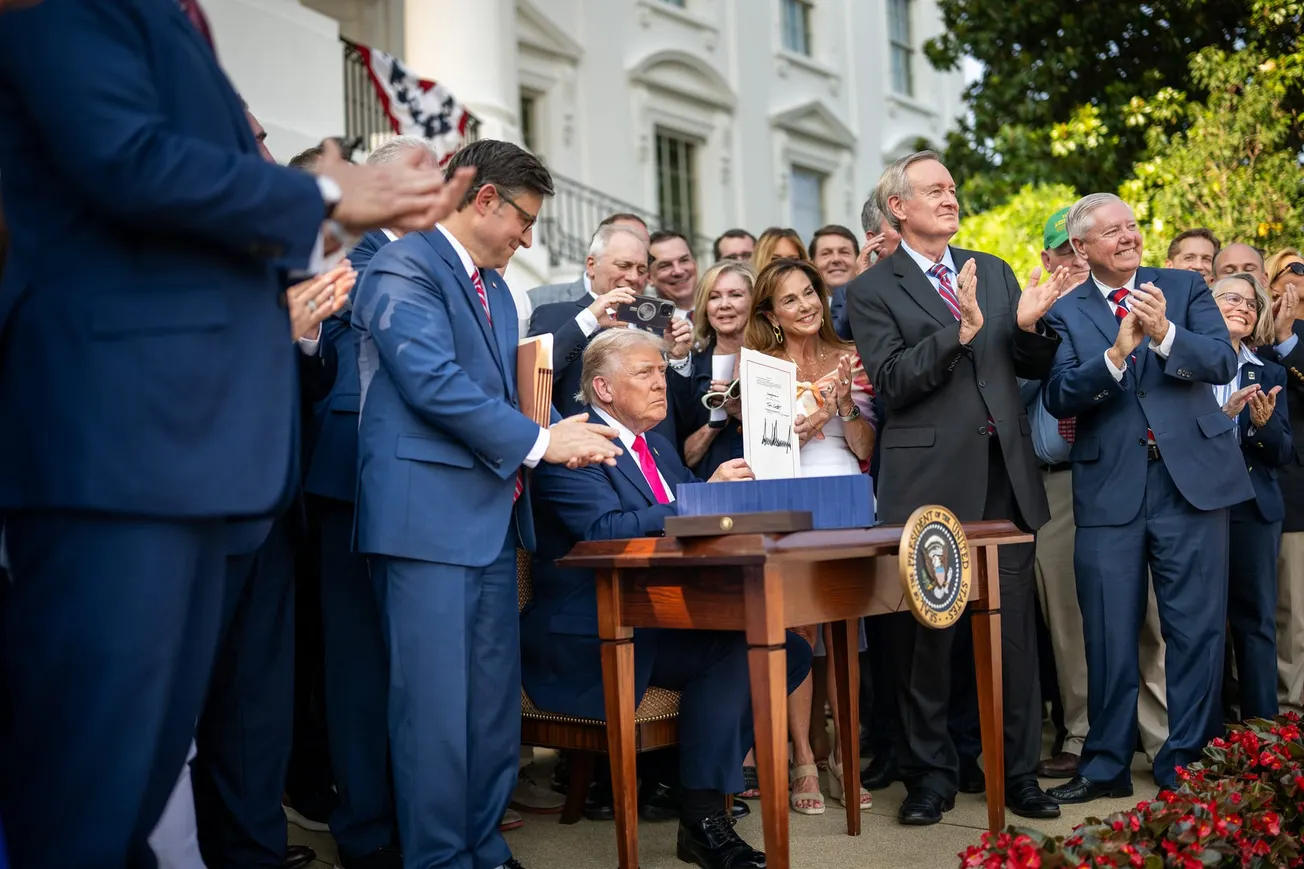 President Donald Trump signs the One Big Beautiful Bill Act on the South Lawn of the White House, Friday, July 4, 2025, during the 4th of July picnic.