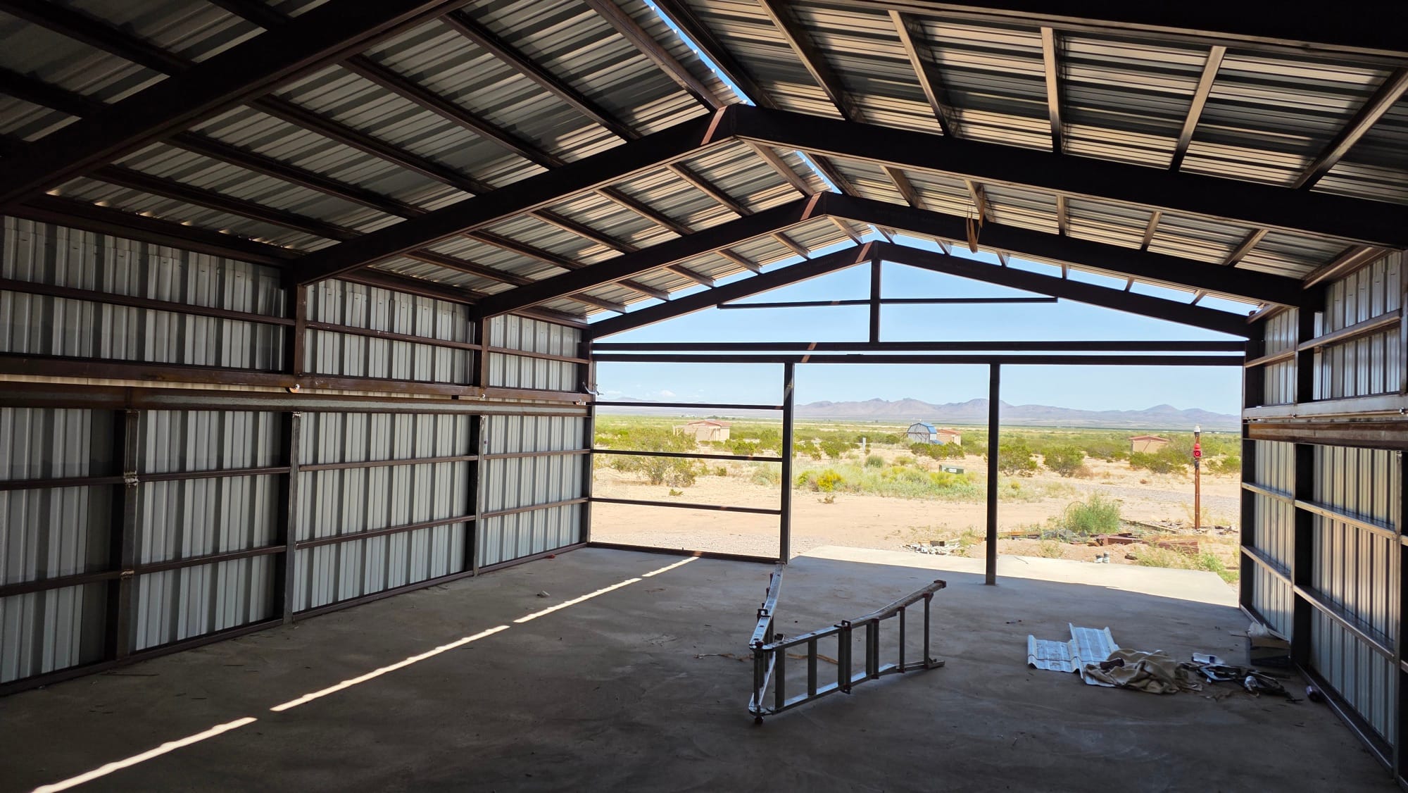 Empty interior of Observatory 21, looking out through the open end toward the New Mexico desert