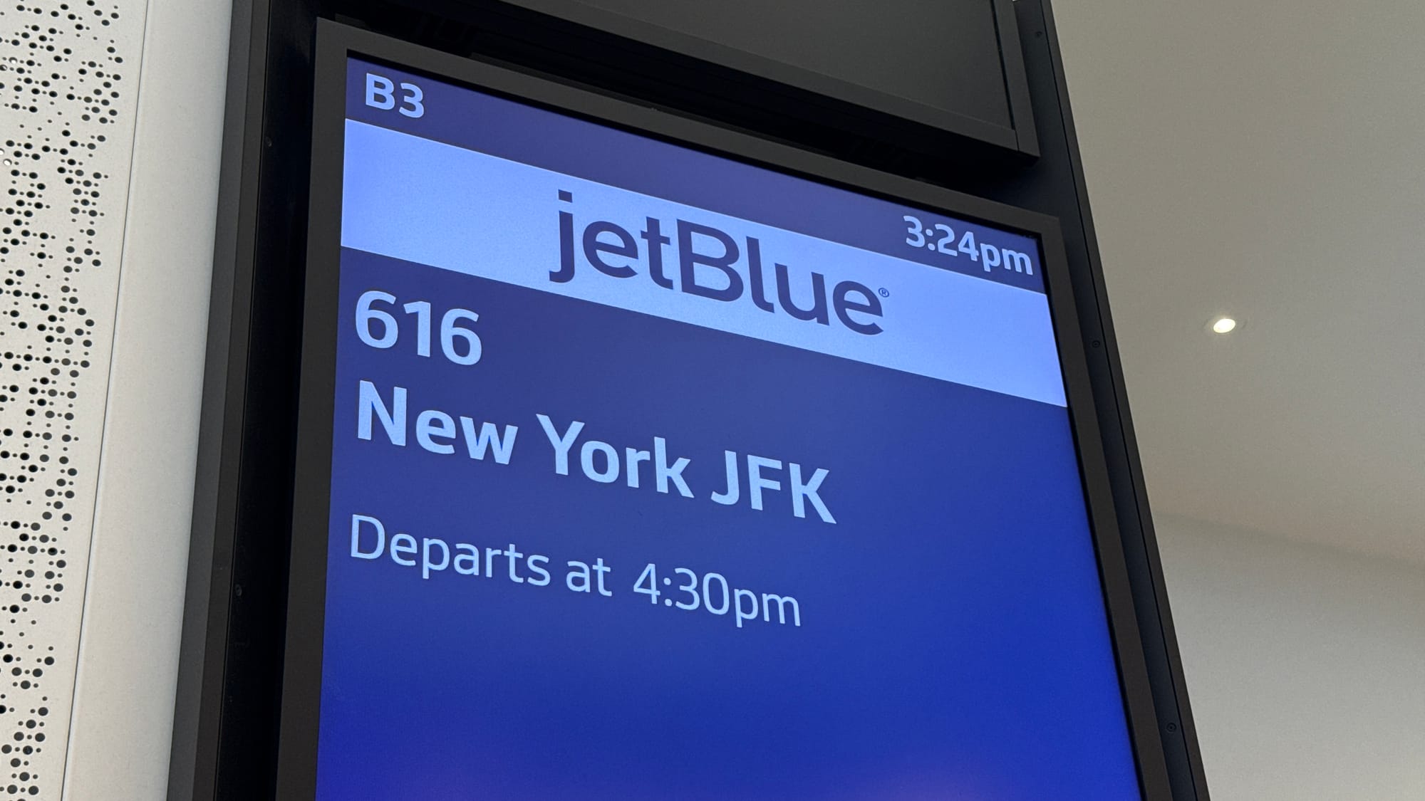 JetBlue gate display at San Francisco airport showing flight 616 to New York JFK departing at 4:30 p.m.