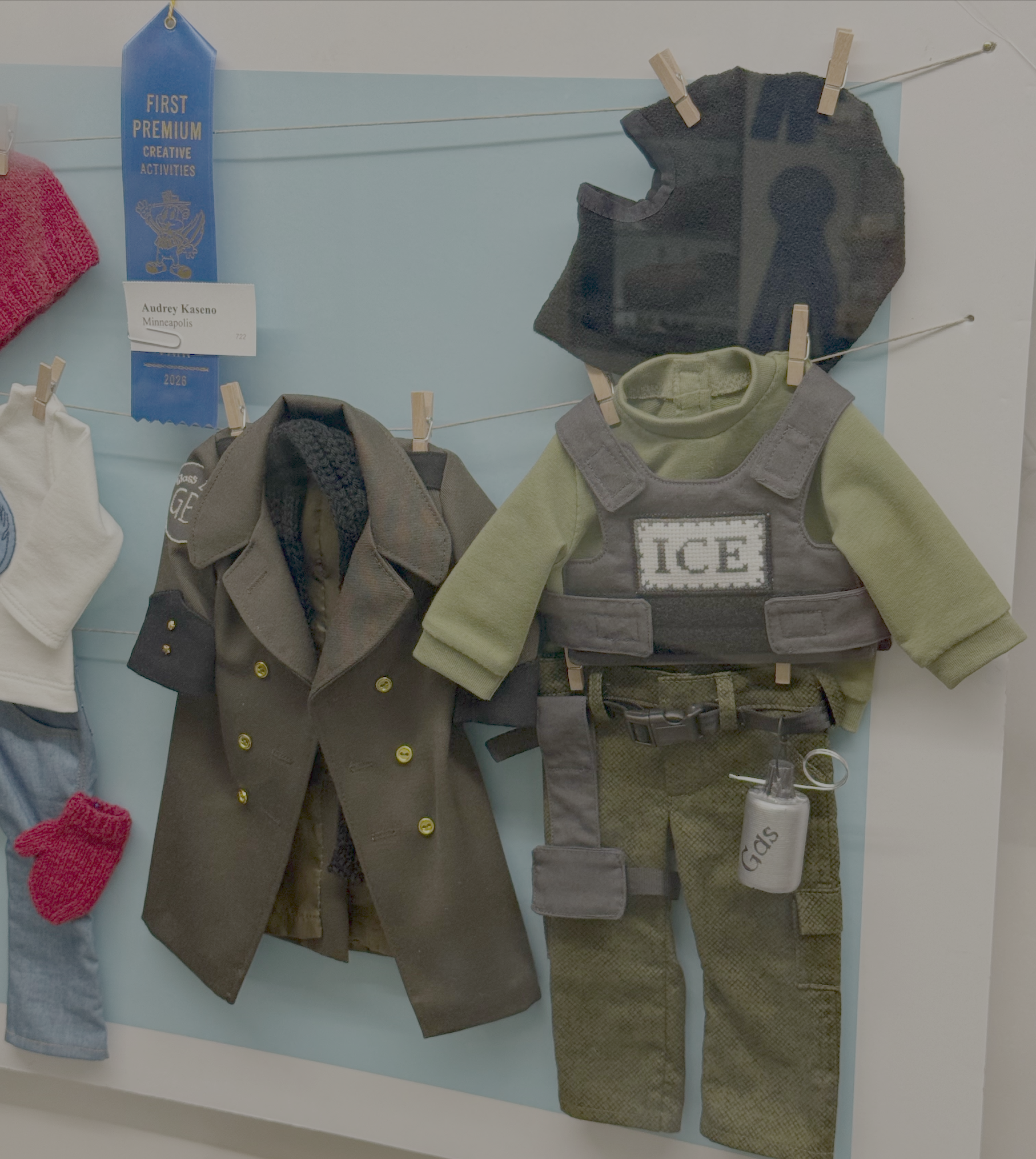 From the Minnesota State Fair: a Bovino coat and ICE attire, sewn for an American Girl doll.