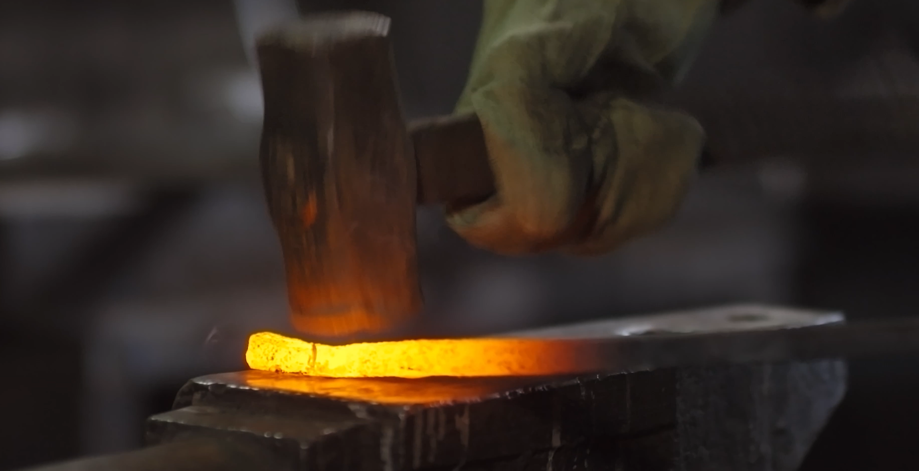 Forging metal in fire — a visual representation of the unpolished, lived experience of becoming resilient.