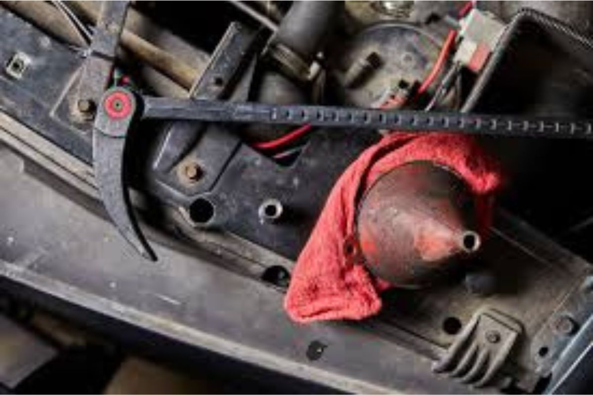 An indexing pry bar laying on the radiator shroud of an old Chevrolet truck, doing work!