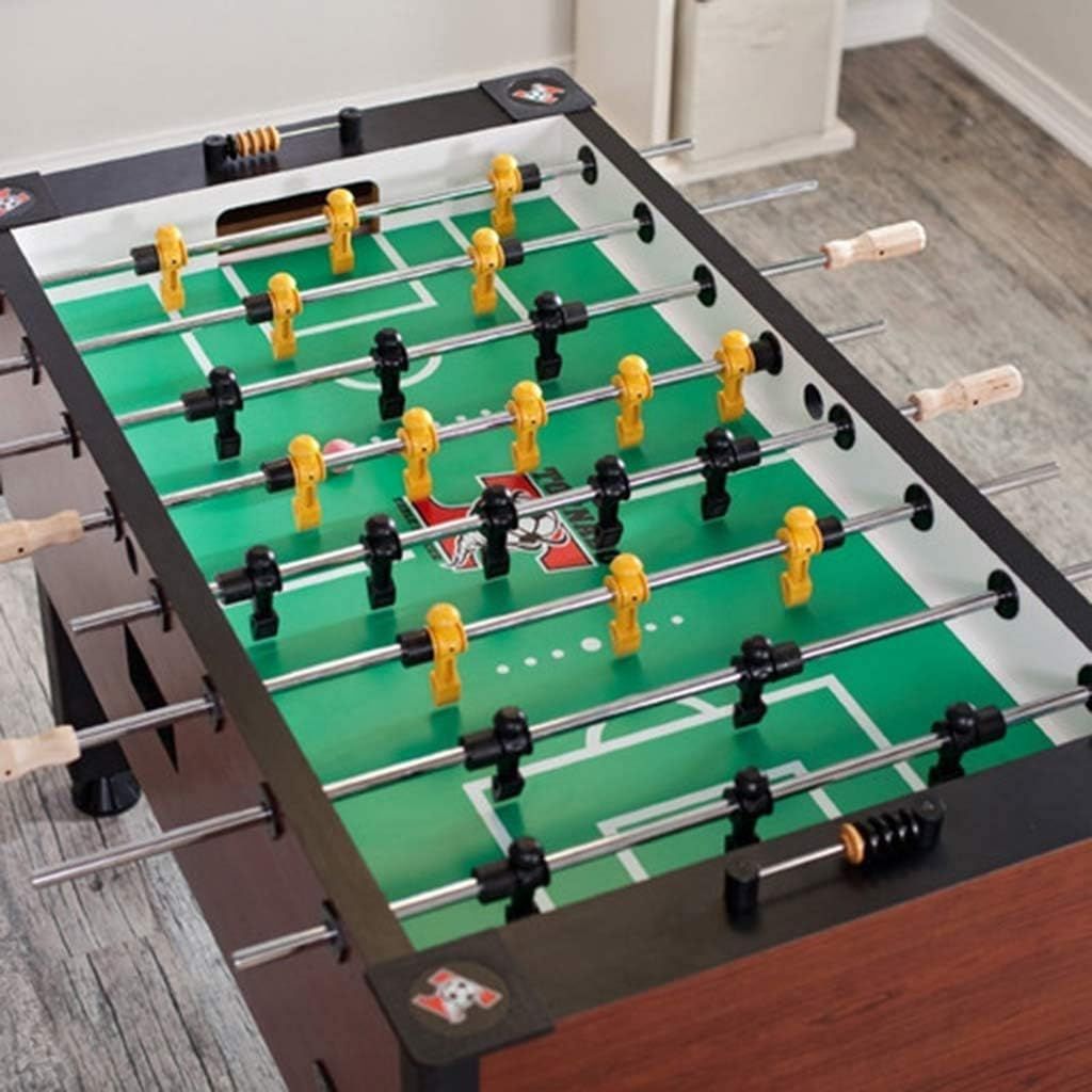 A Tornado foosball table on a wooden floor.