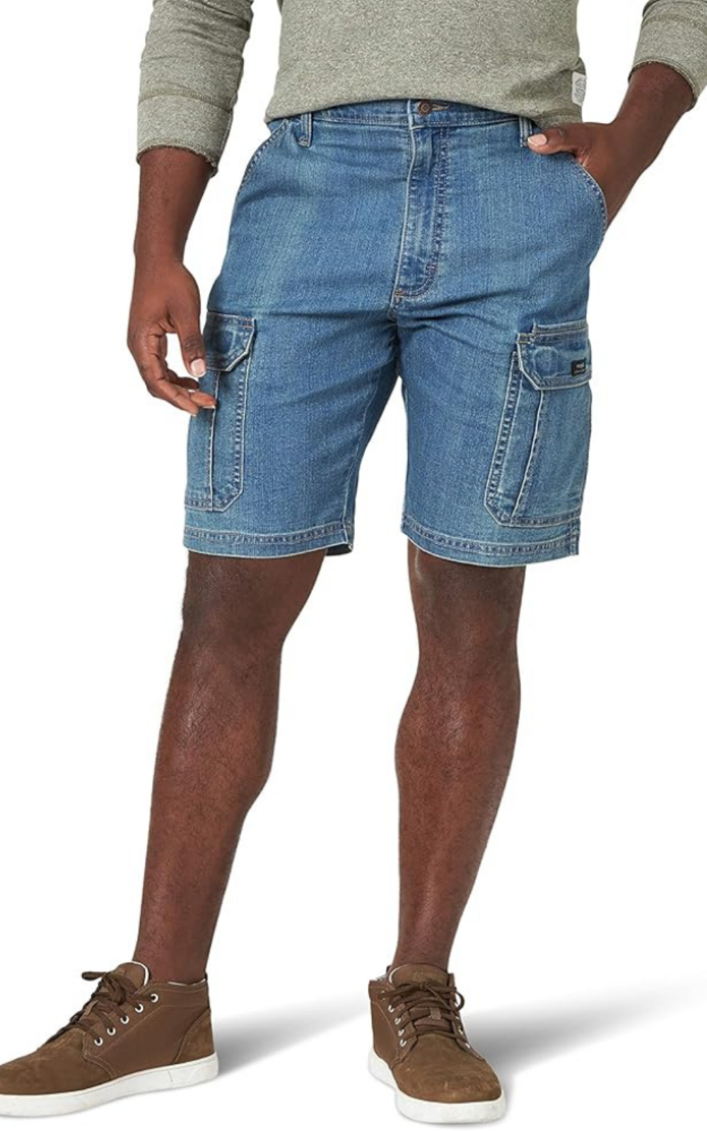 A man wearing denim cargo shorts