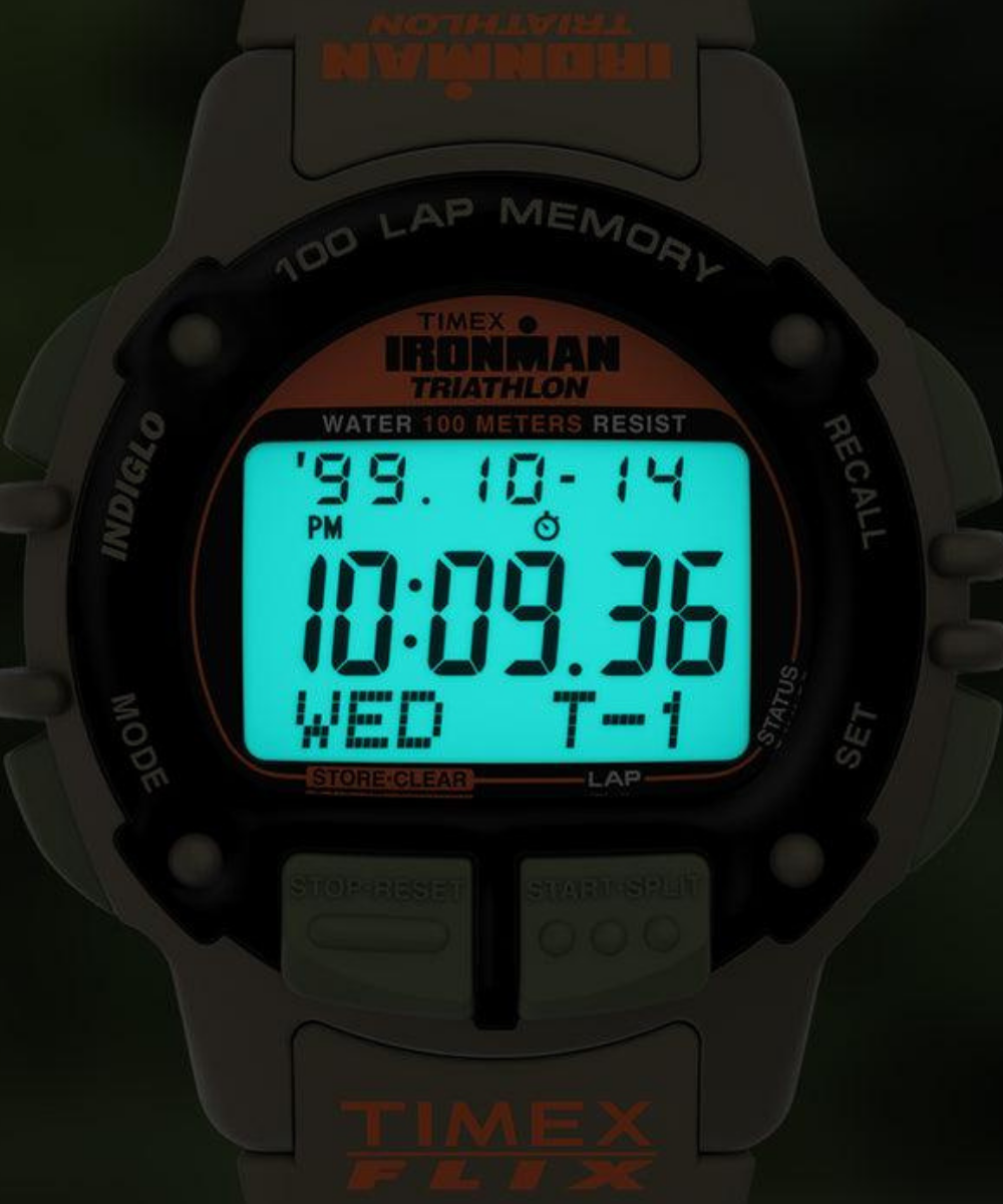 Timex Ironman digital sports watch on wrist during outdoor run with rugged durable design and illuminated display