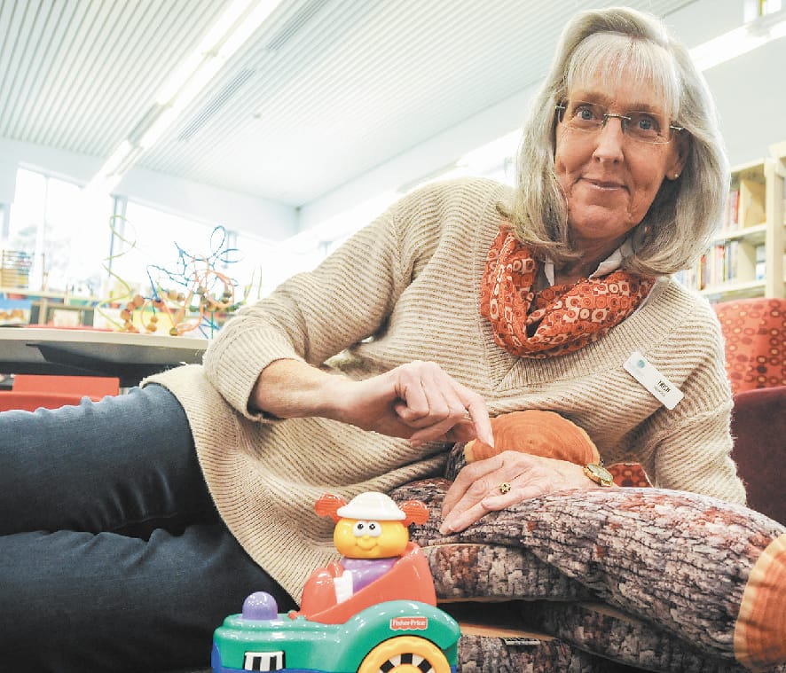 Library volunteer shares her love of reading with Hills children
