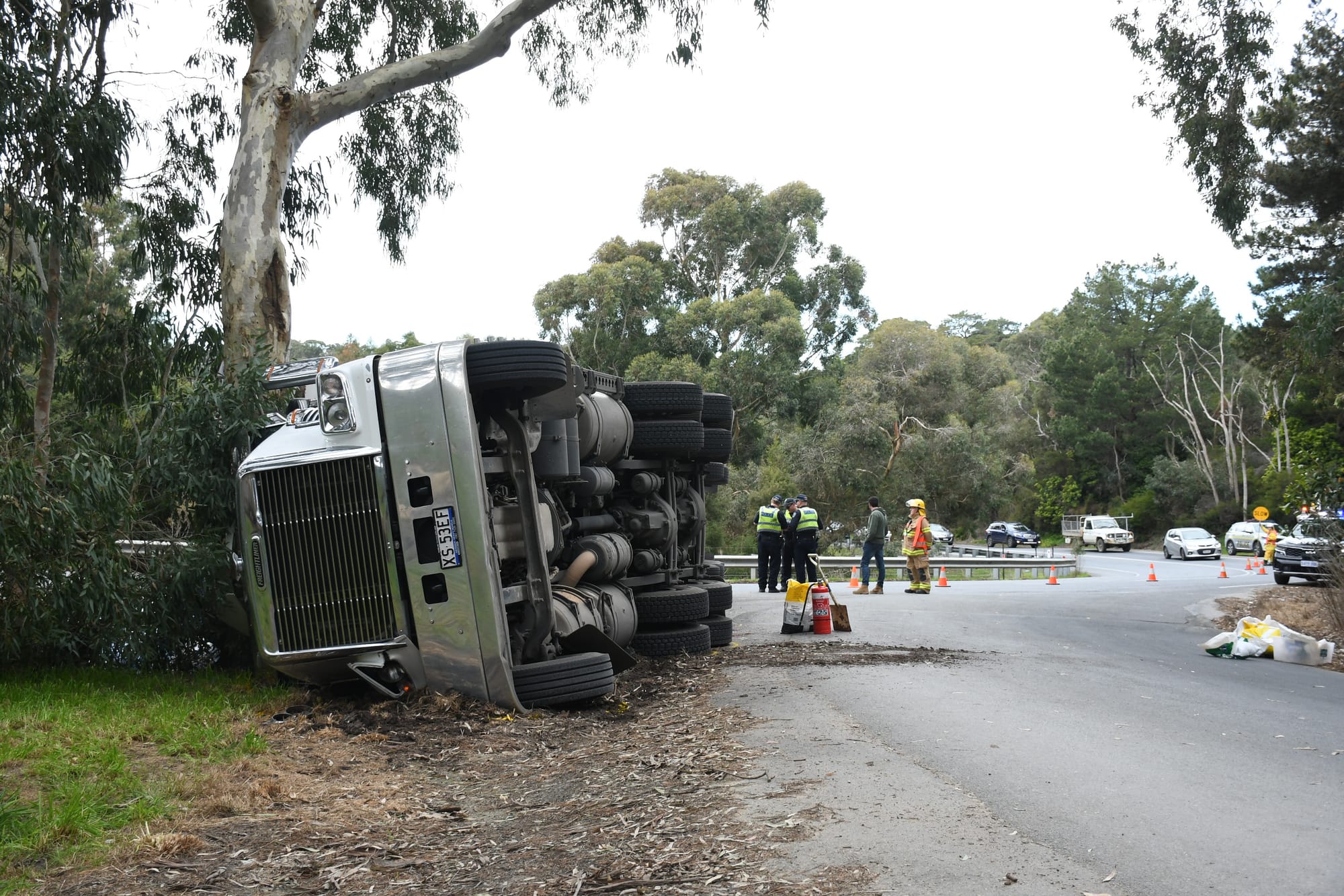 Driver escapes major injury when truck rolls
