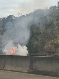 Car catches fire on freeway post image