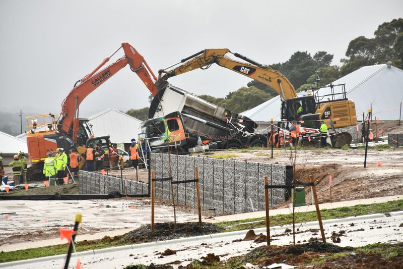 Excavators assist during truck rescue post image