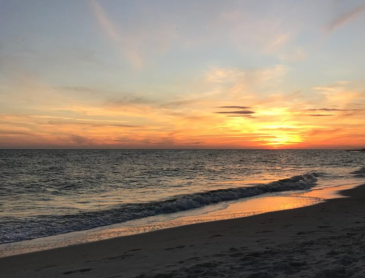 A white sand beach at sunset