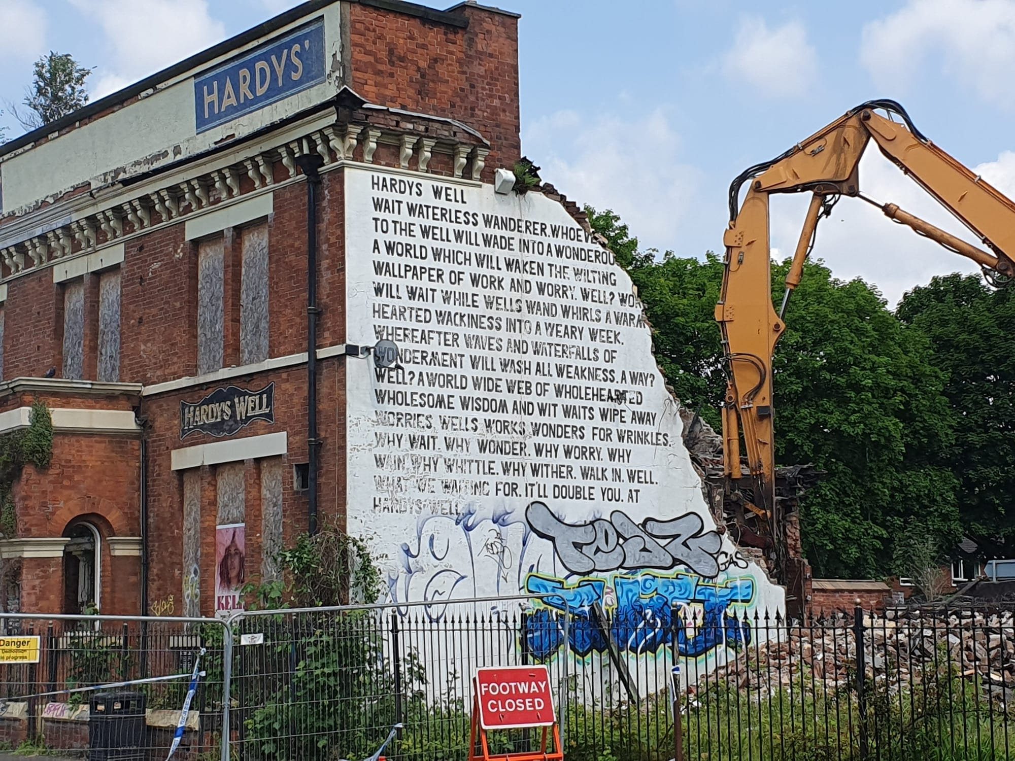 Hardy’s Well being demolished, with police tape on the fences. Photo by Suzi Hoffman.
