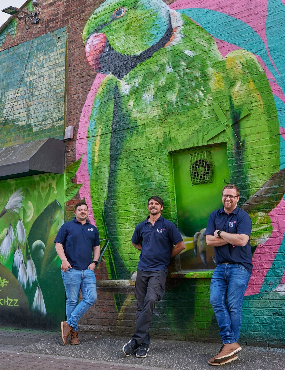 Brsk's engineers in action. Well, posing in front of a giant green parakeet - an artwork by @_peachzz_ that is part of the amazing Withington Walls project. 