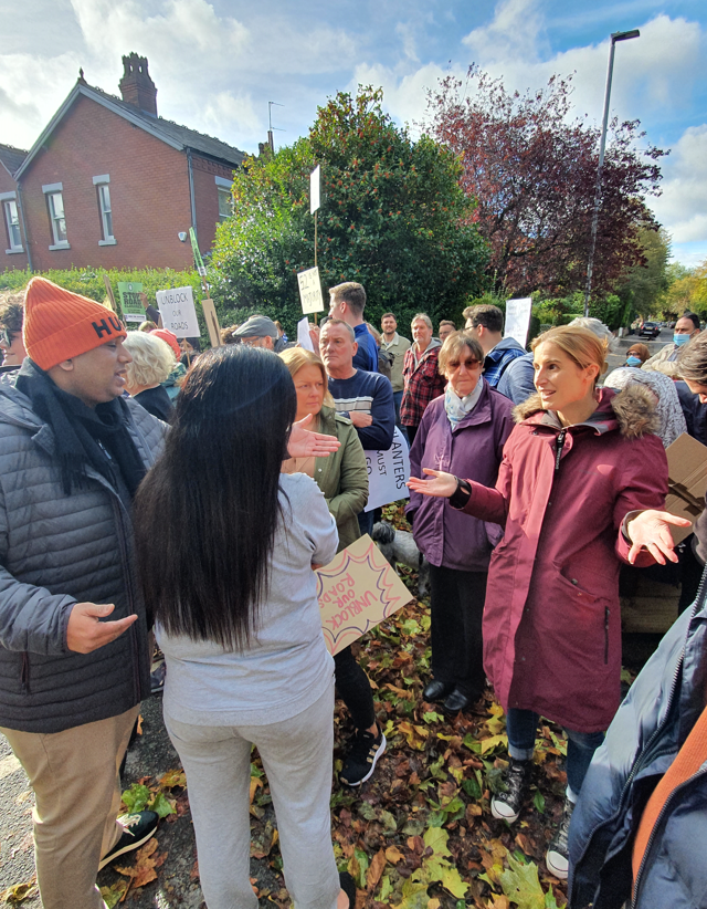 The debate kicks off at the protest. Photo: The Mill.
