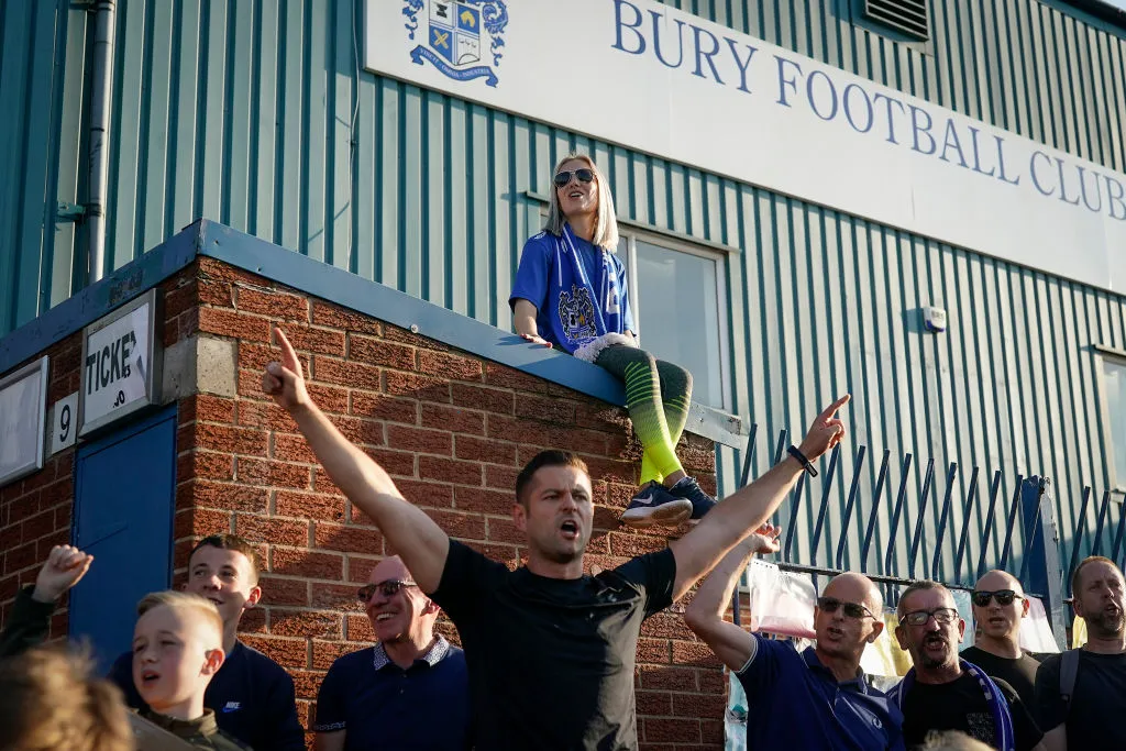 Fans chant outside Gigg Lane awaiting a rescue plan for the ill-fated club on August 23, 2019. Photo by Christopher Furlong via Getty Images.