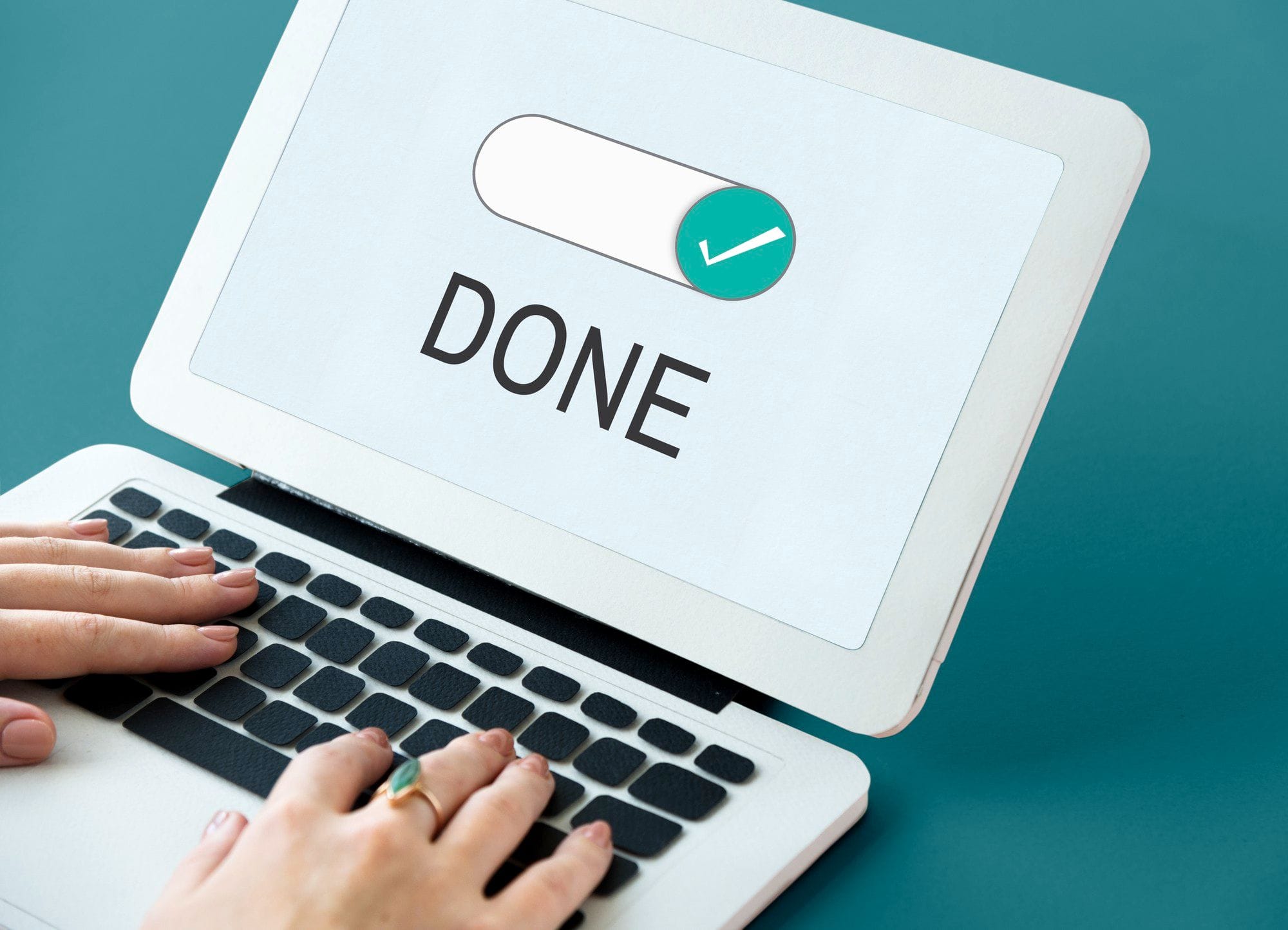 An image of a laptop that says 'Done' on the screen.