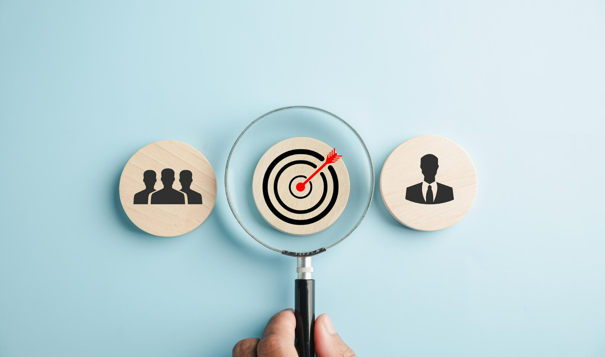 An image showing wooden blocks representing customers and conversion targets.