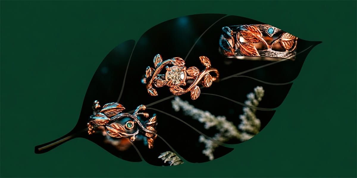 Handcrafted solid gold rings with leaf detail, showing the natural variation of hand-finished jewelry