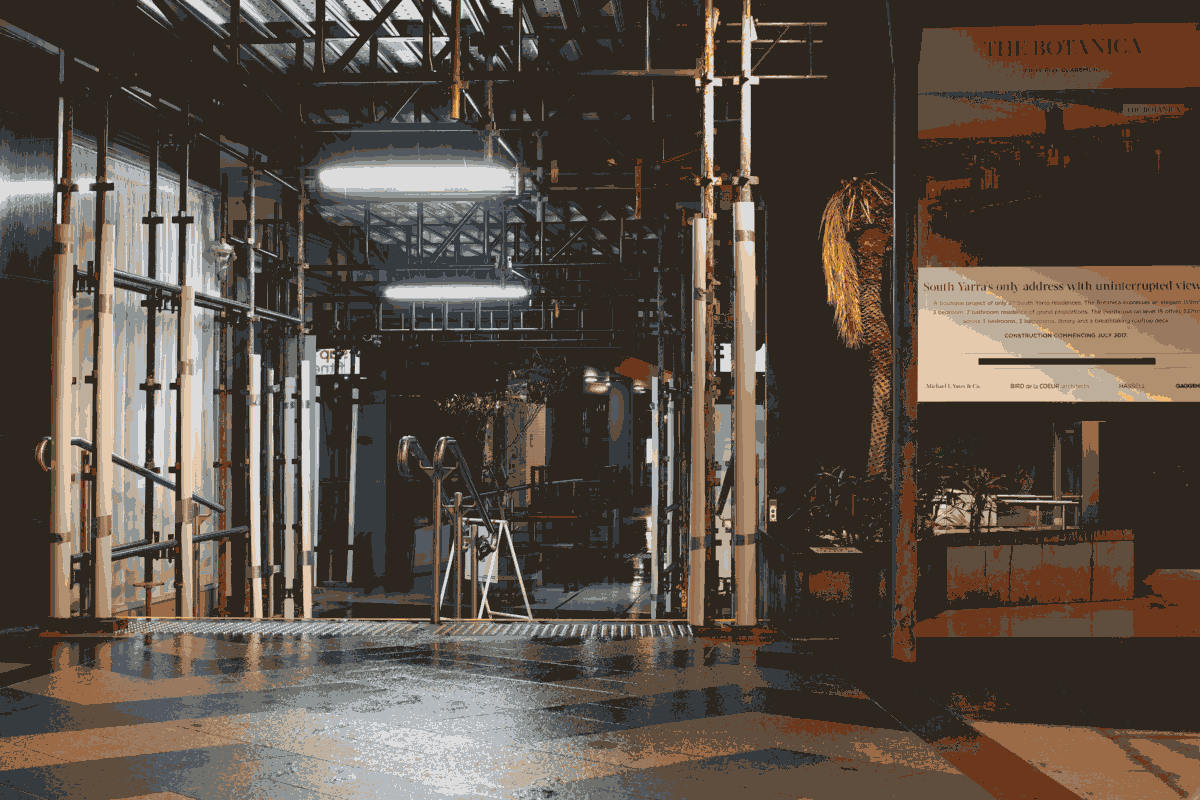 16-bit colour palette of Melbourne. A medium shot of construction works in a lane way.