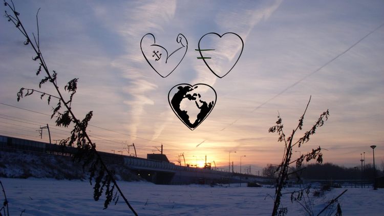 Sunrise over a wintery, desolate city scene.