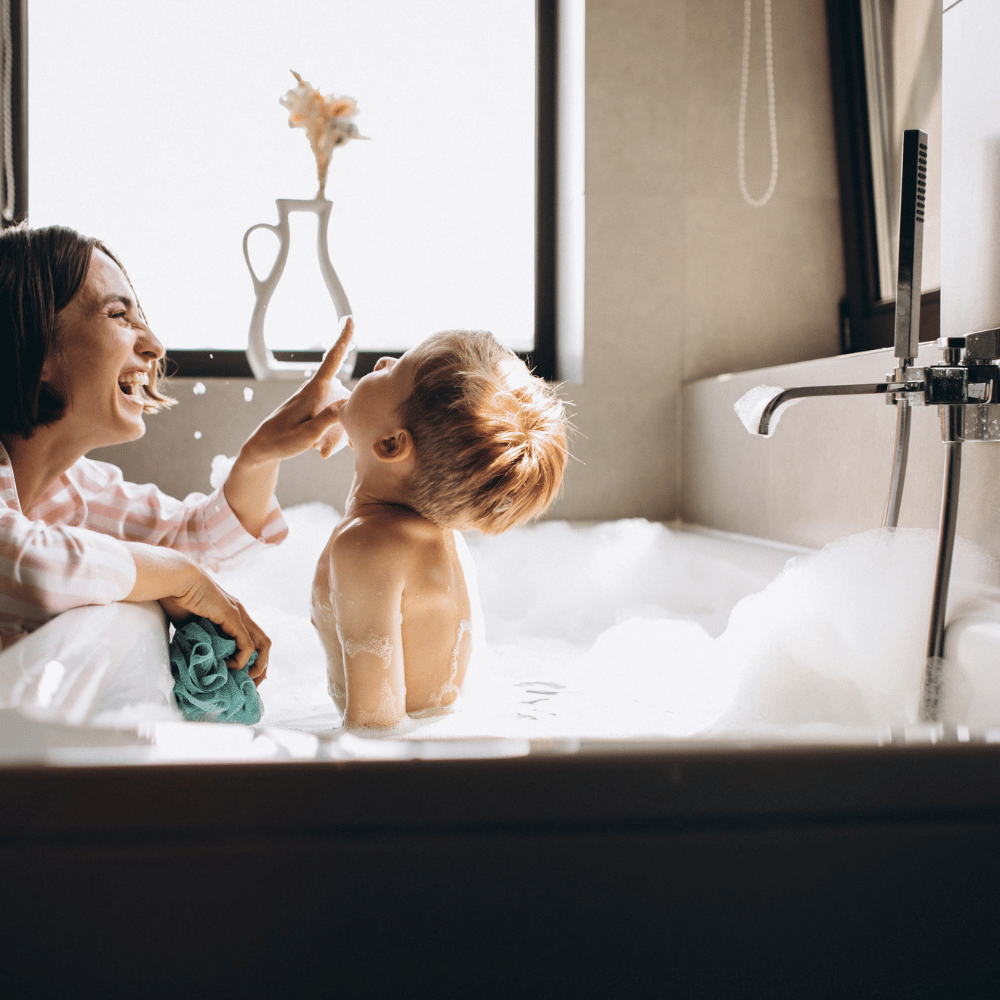 mom bathing her son