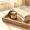  Single amber jar of cream on a wooden tray in warm morning light