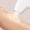 Laser treatment handpiece in warm clinical light