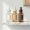 Three vitamin C serums in different stages of oxidation on a shelf