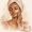 Dark skin woman putting cream on her face in bathroom