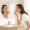 Woman examining a specific area of her cheek closely in a mirror