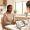 Woman in a clinical consultation discussing treatment options