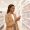 Woman with deep brown skin calmly evaluating a wall of brightening products in a retail aisle