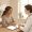 Woman with medium-brown skin in a calm conversation with a practitioner