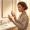  Woman comparing two serum concentrations at her bathroom vanity