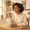 Woman at a kitchen table with supplements and skincare products