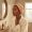 Woman examining her skin after a cosmetic procedure