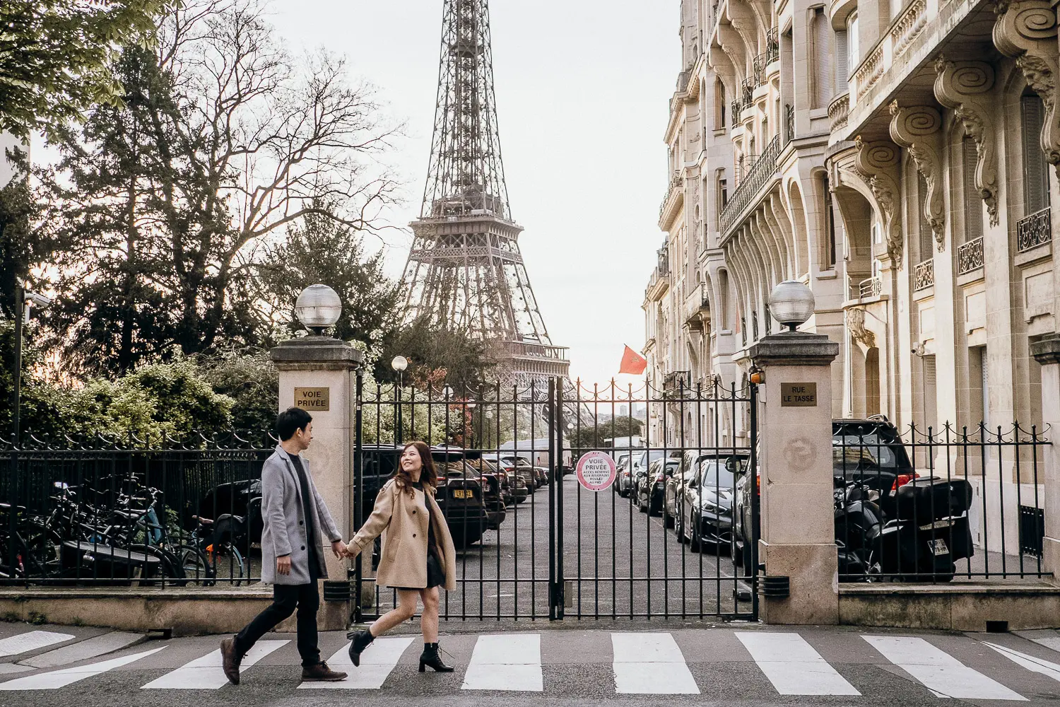 A classic Parisian street view leads to the Eiffel Tower