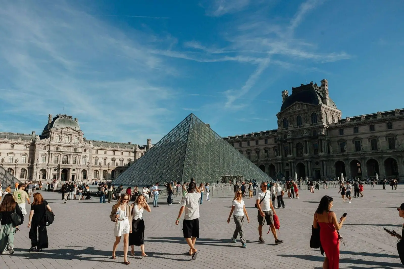 Vibrant day at Louvre pyramid