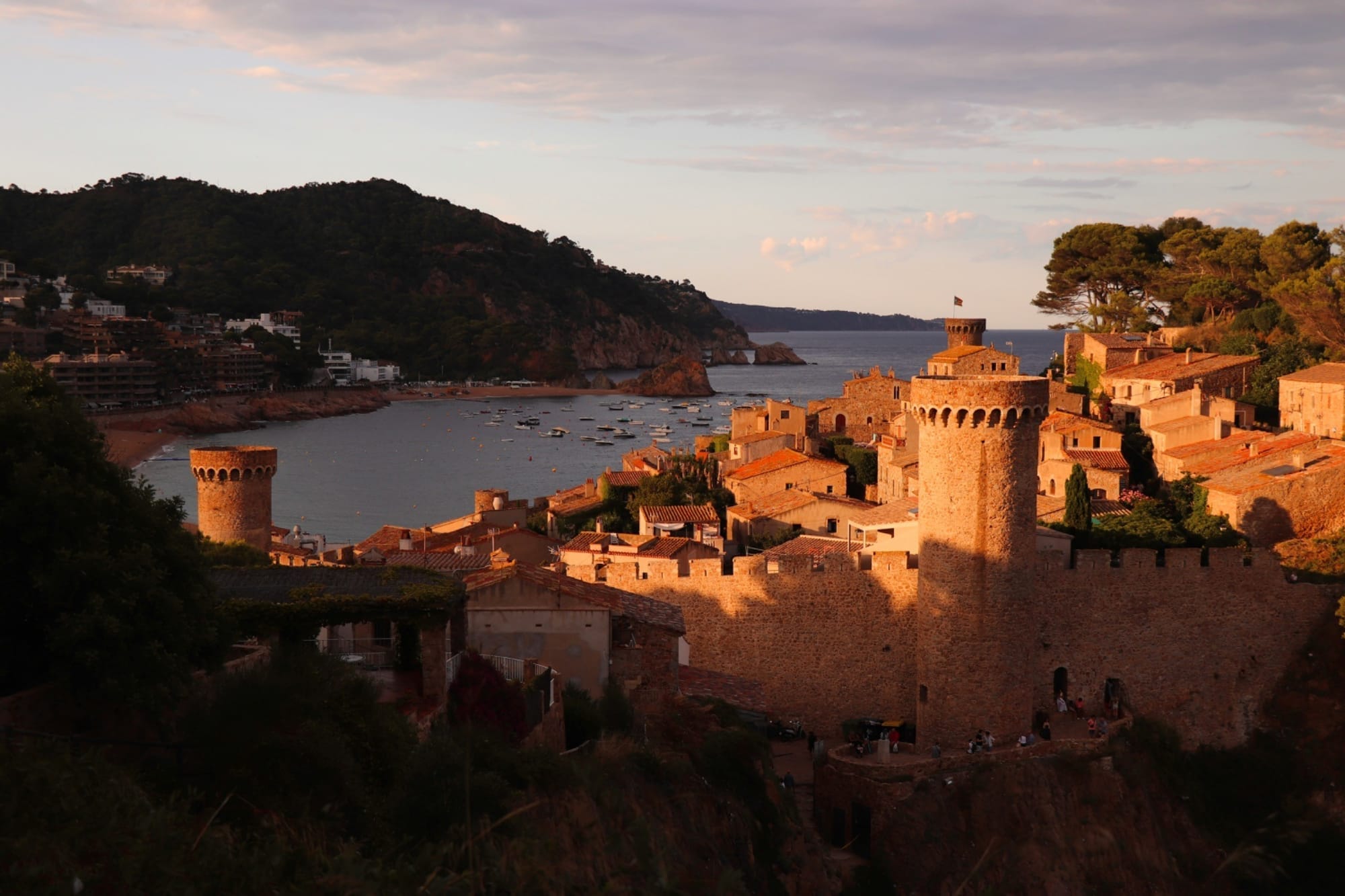 castle-ruins-overlooking-a-bay-at-sunset