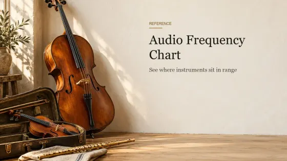 A cello leaning against a wall beside a violin in an open case and a brass flute on a linen cloth on oak floorboards.