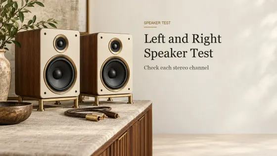 Two small cream-fronted hi-fi speakers on brass stands with an RCA cable between them on a linen-covered sideboard.